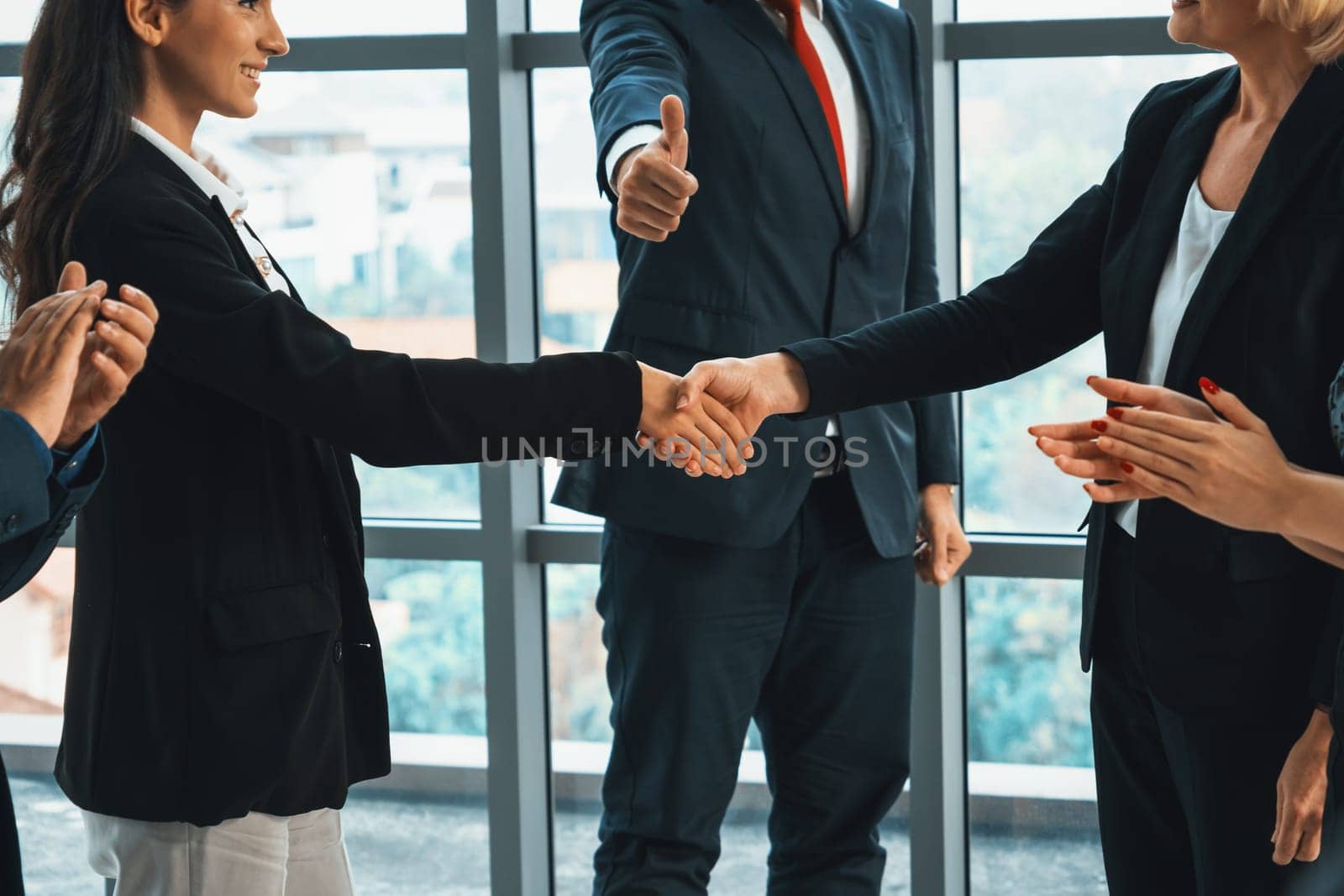 Business people handshake in corporate office Jivy by biancoblue
