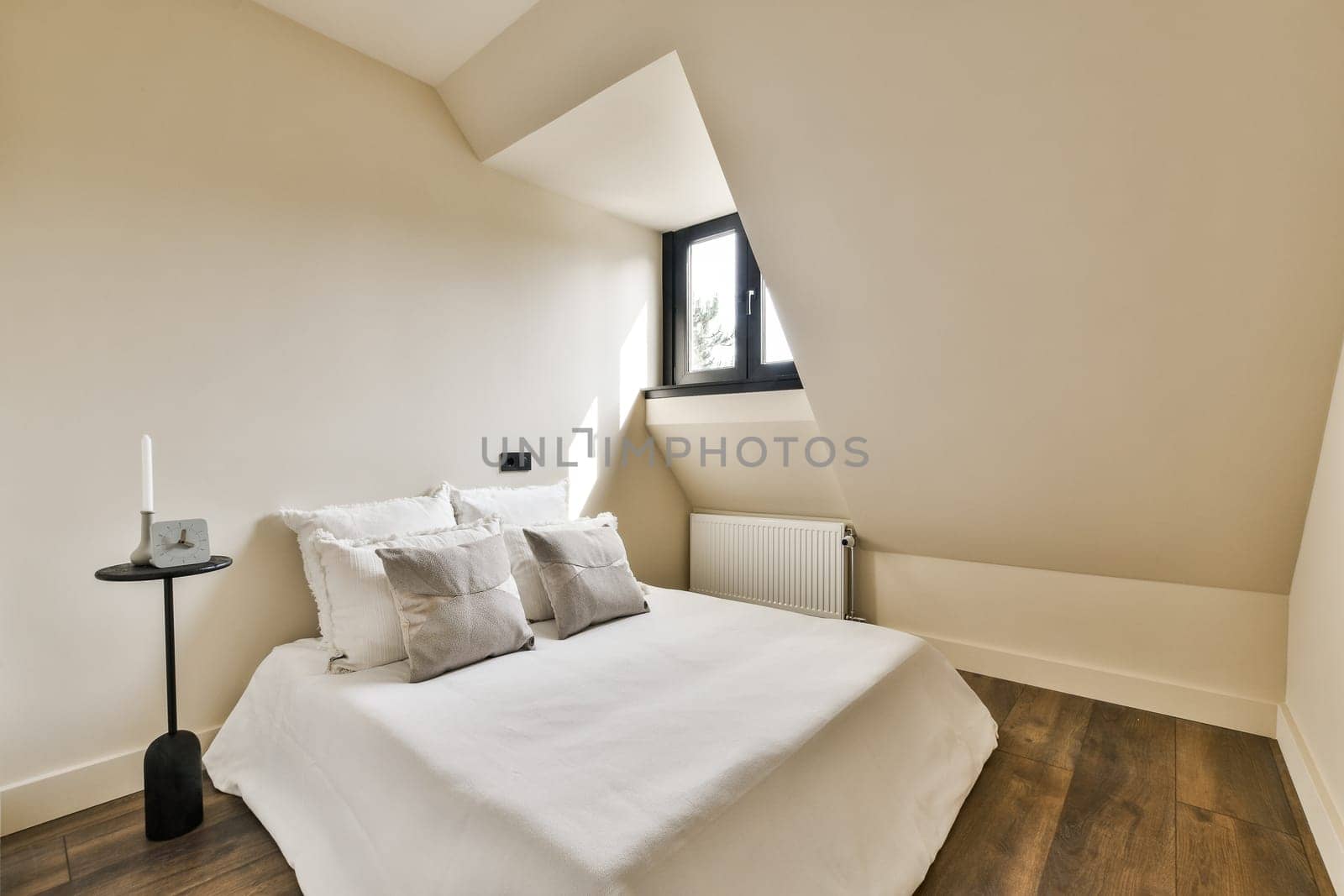 a bedroom with a white bed and a window by casamedia