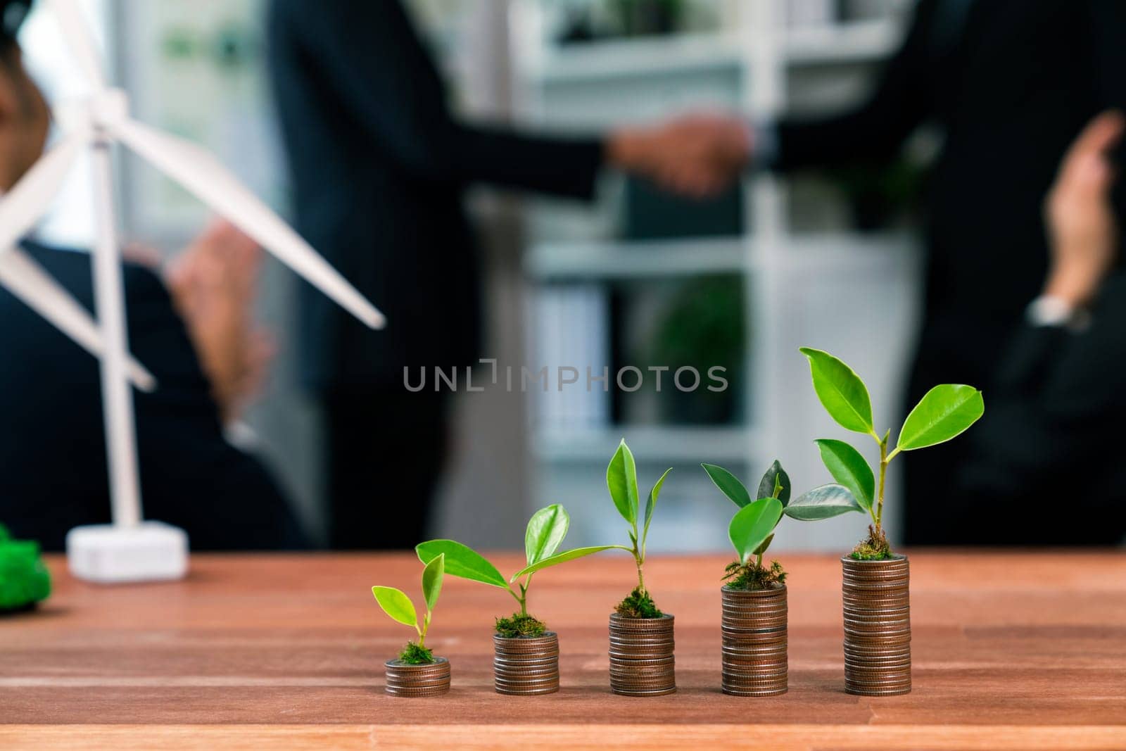 Organic money growth investment concept with stacking coin and plant. Quaint by biancoblue