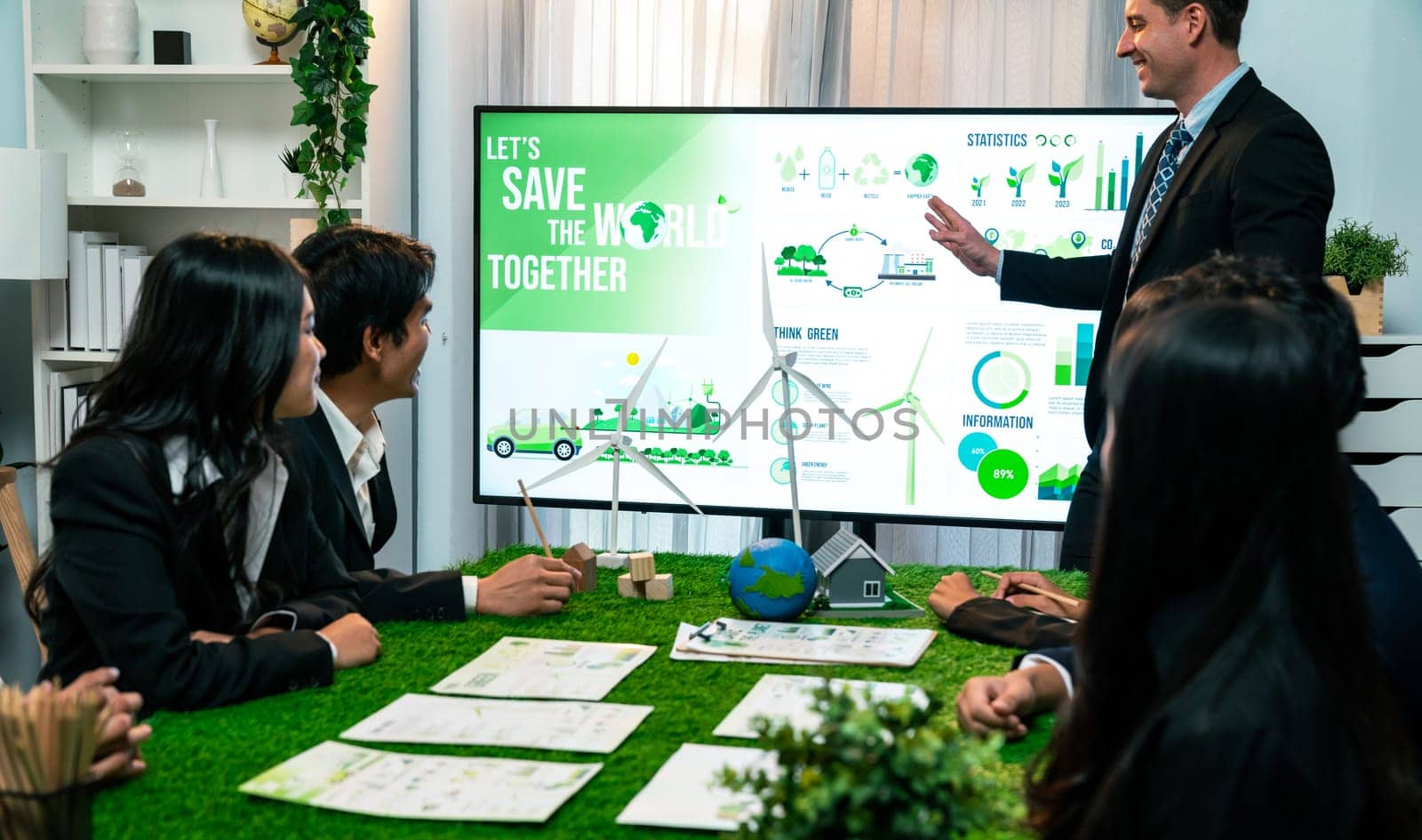 Businessman leader give presentation on eco-friendly implementation in order to reduce CO2 emission and make sustainable ecology for greener future with renewable alternative energy technology. Quaint