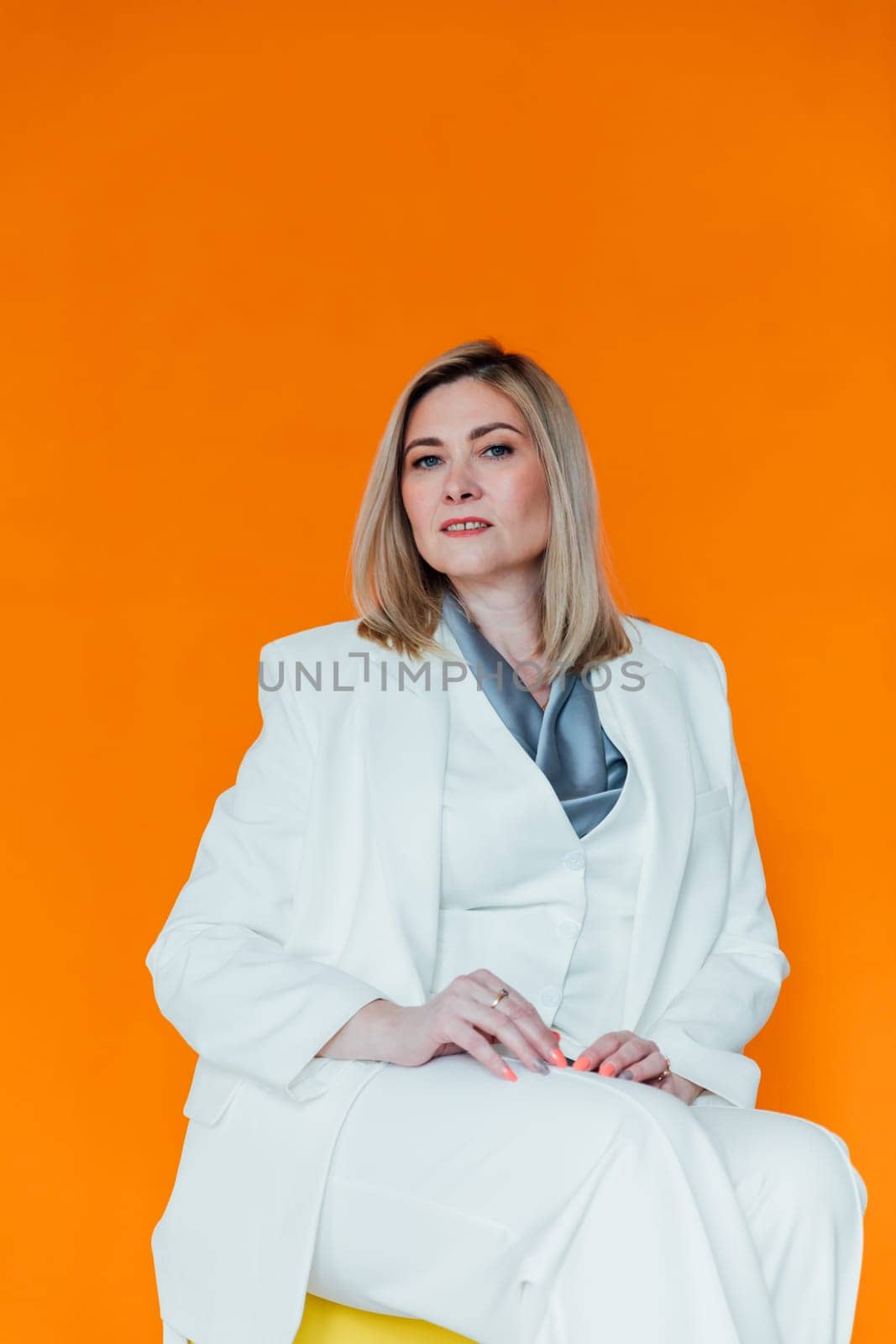 40 year old woman in suit in office