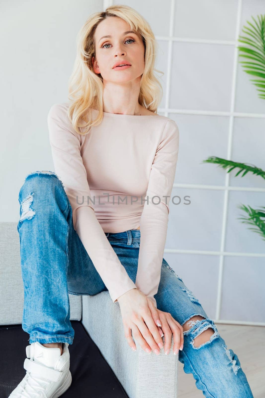 Blonde woman in stylish streetwear casual life by Simakov