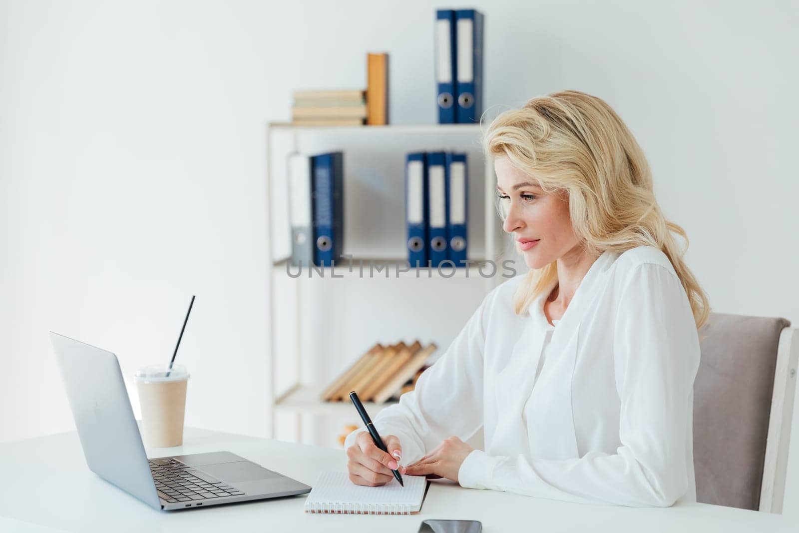 Business woman secretary working with laptop computer in office