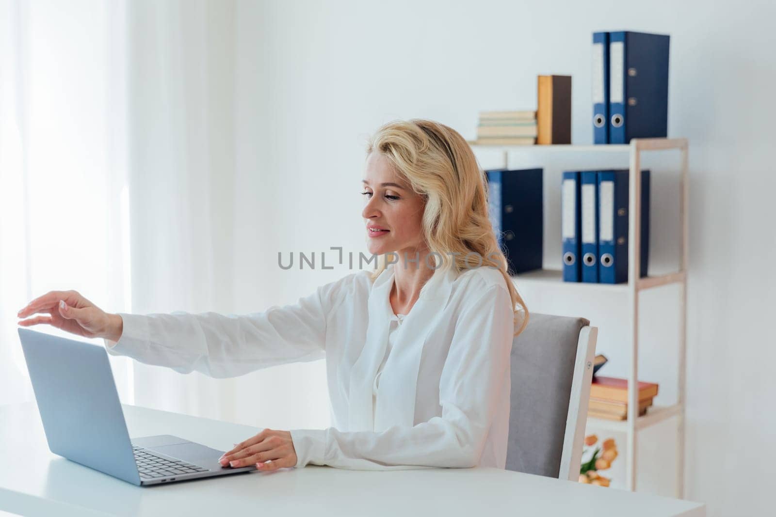 Business Woman Secretary Working Online Remotely With Laptop Computer In Office