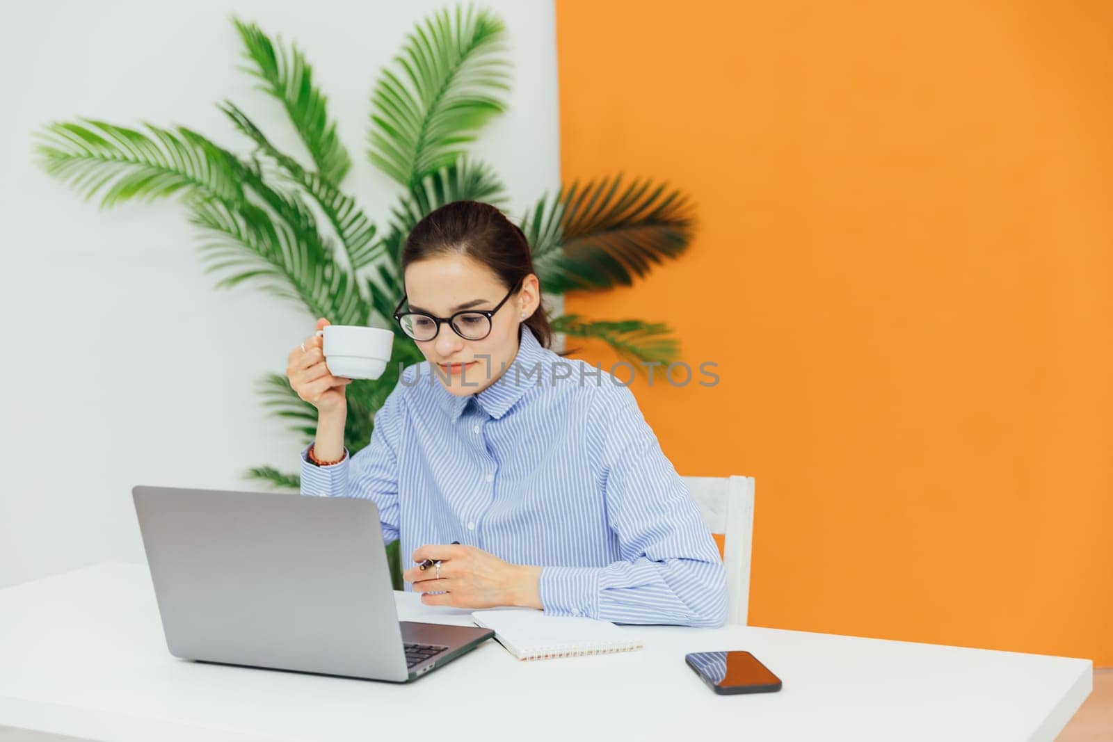 woman in office working online on computer