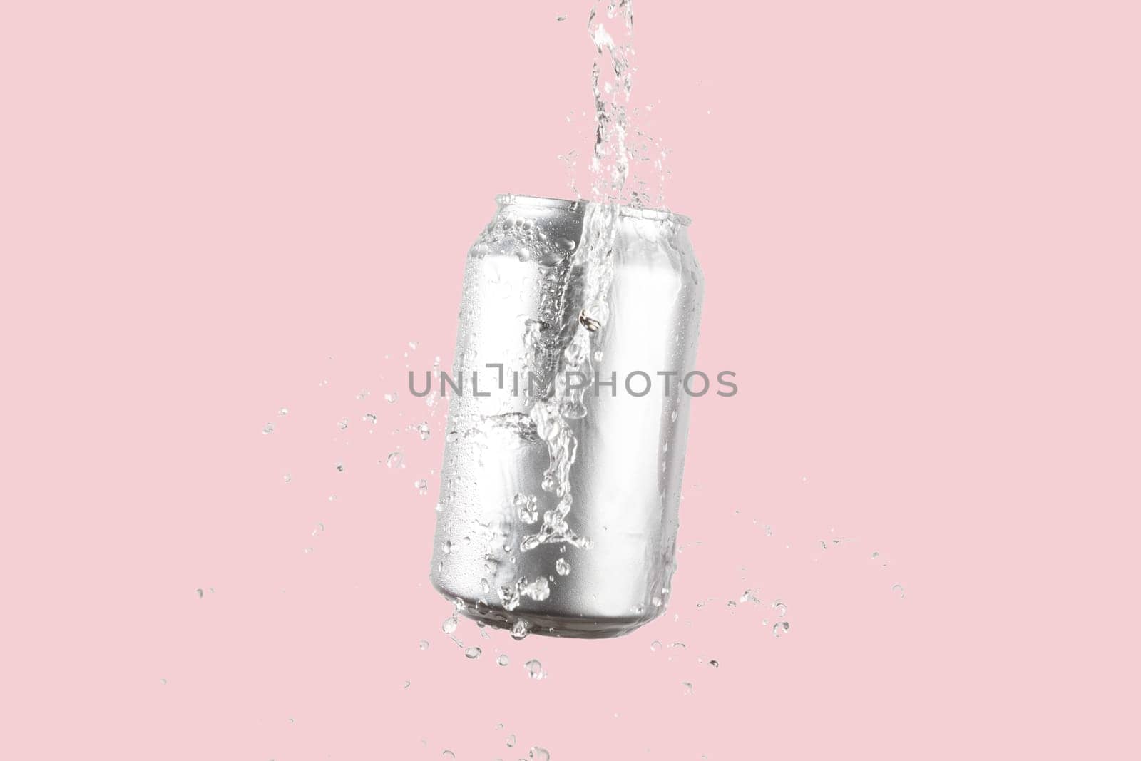 Aluminium beer or soda drinking can with water splash on light pink background by TropicalNinjaStudio