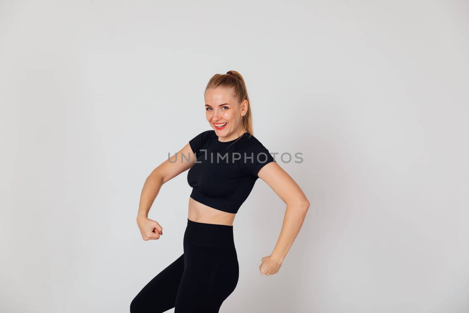 woman in tracksuit in gym exercise sport