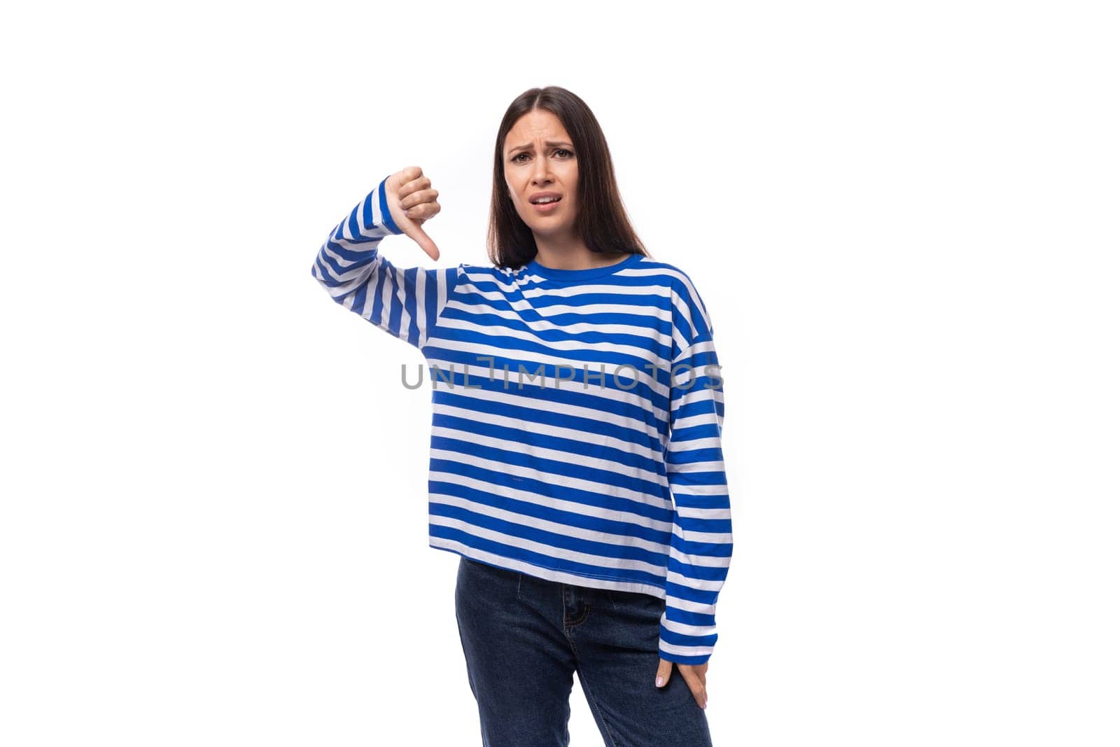 young stylish brunette lady in a striped blue turtleneck on a white background with copy space. people lifestyle concept.