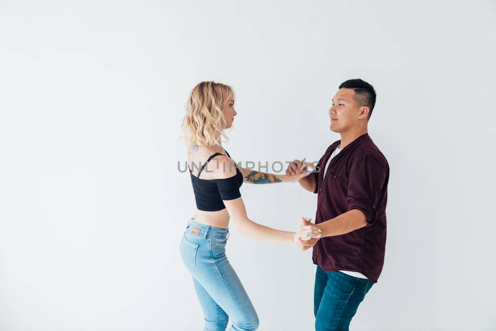a man and a woman dance bachata latin casombu salta in the studio hall