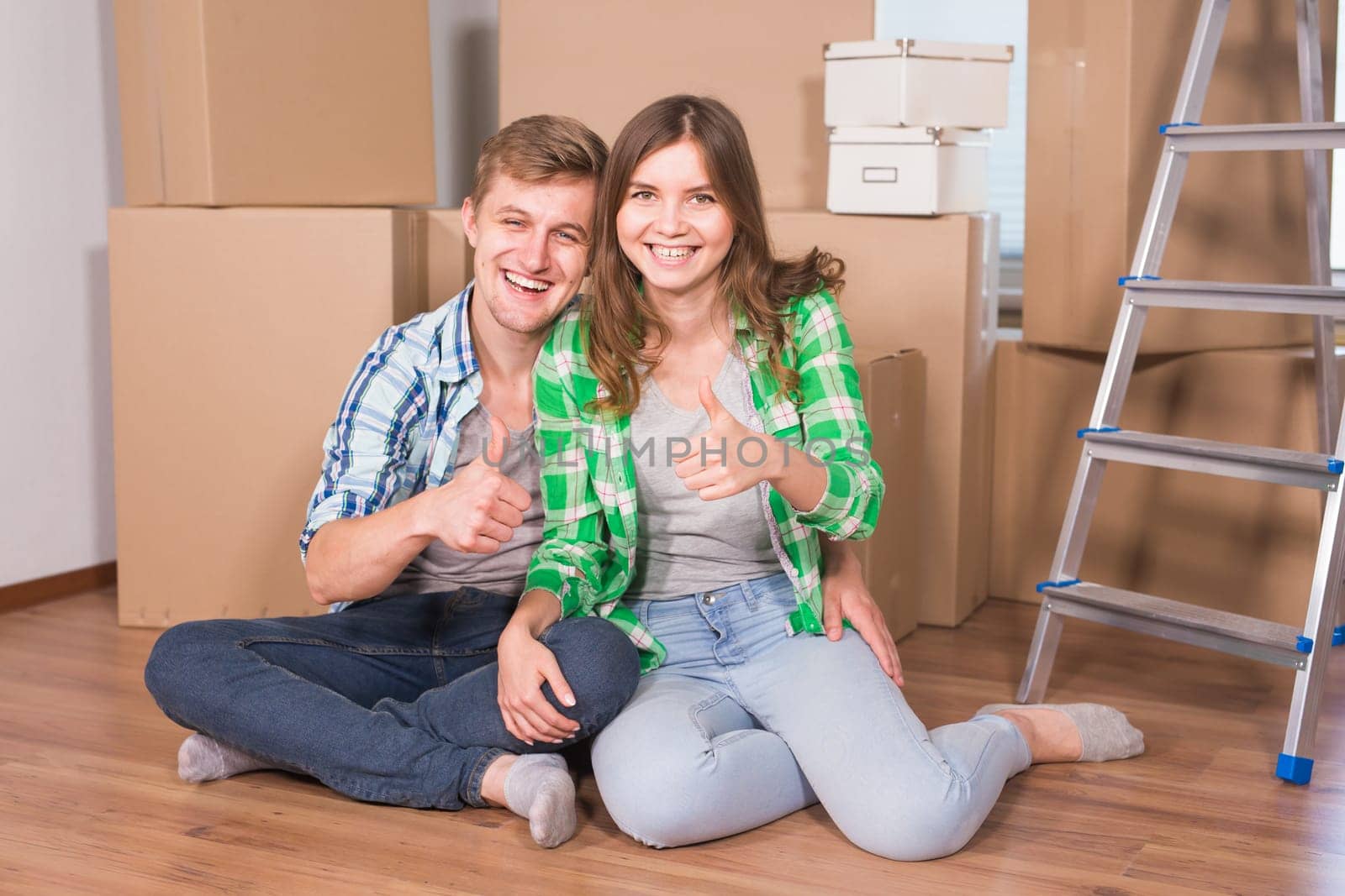 Home, people, moving and real estate concept - Portrait of happy couple in new home by Satura86