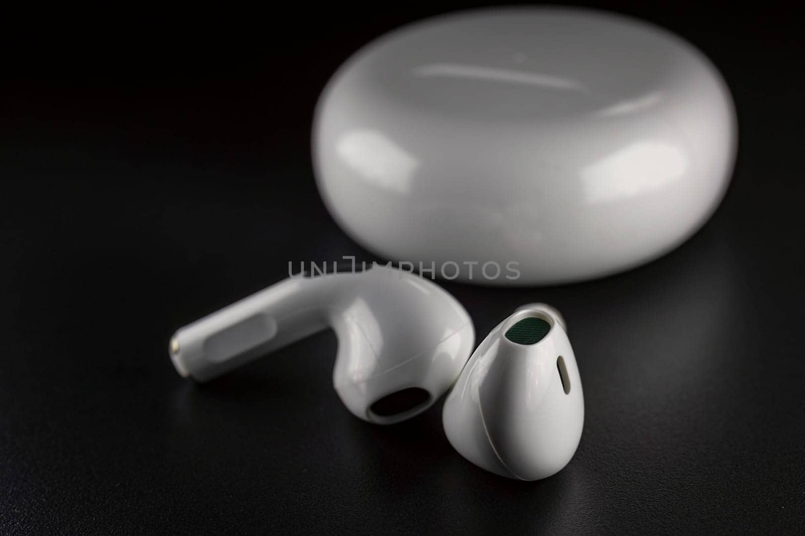 ROSTOV-ON-DON, RUSSIA - APRIL 28, 2018: Apple AirPods wireless Bluetooth headphones and charging case for Apple iPhone. New Apple Earpods Airpods in box. by zokov