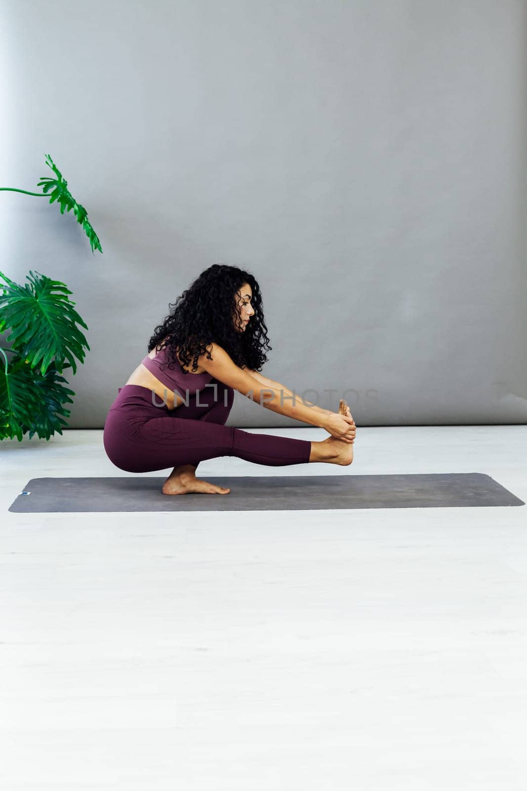 a leg stretching exercises yoga trainer gymnastics acrobatics woman