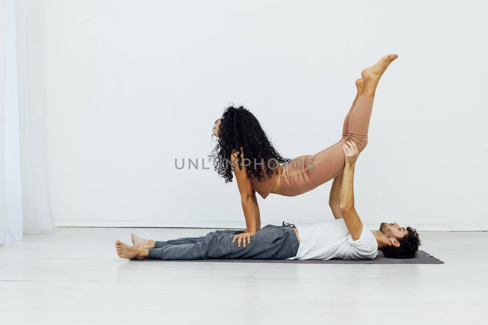 duo for yoga performance stretching spirituality training by Simakov