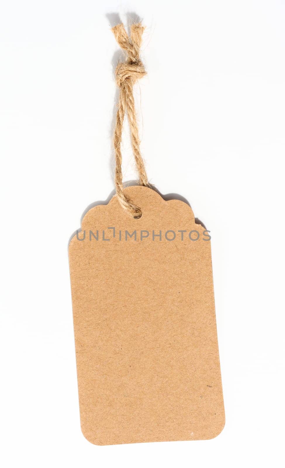 Blank brown rectangular brown paper tag on a rope  on white background, template for price, discount by ndanko