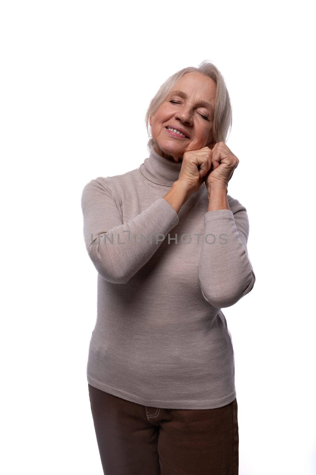 Elderly kind woman with gray hair on a white background by TRMK