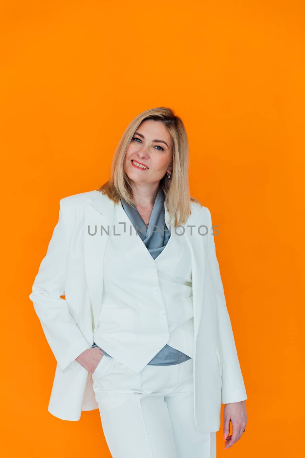 40 year old woman in business suit in office by Simakov