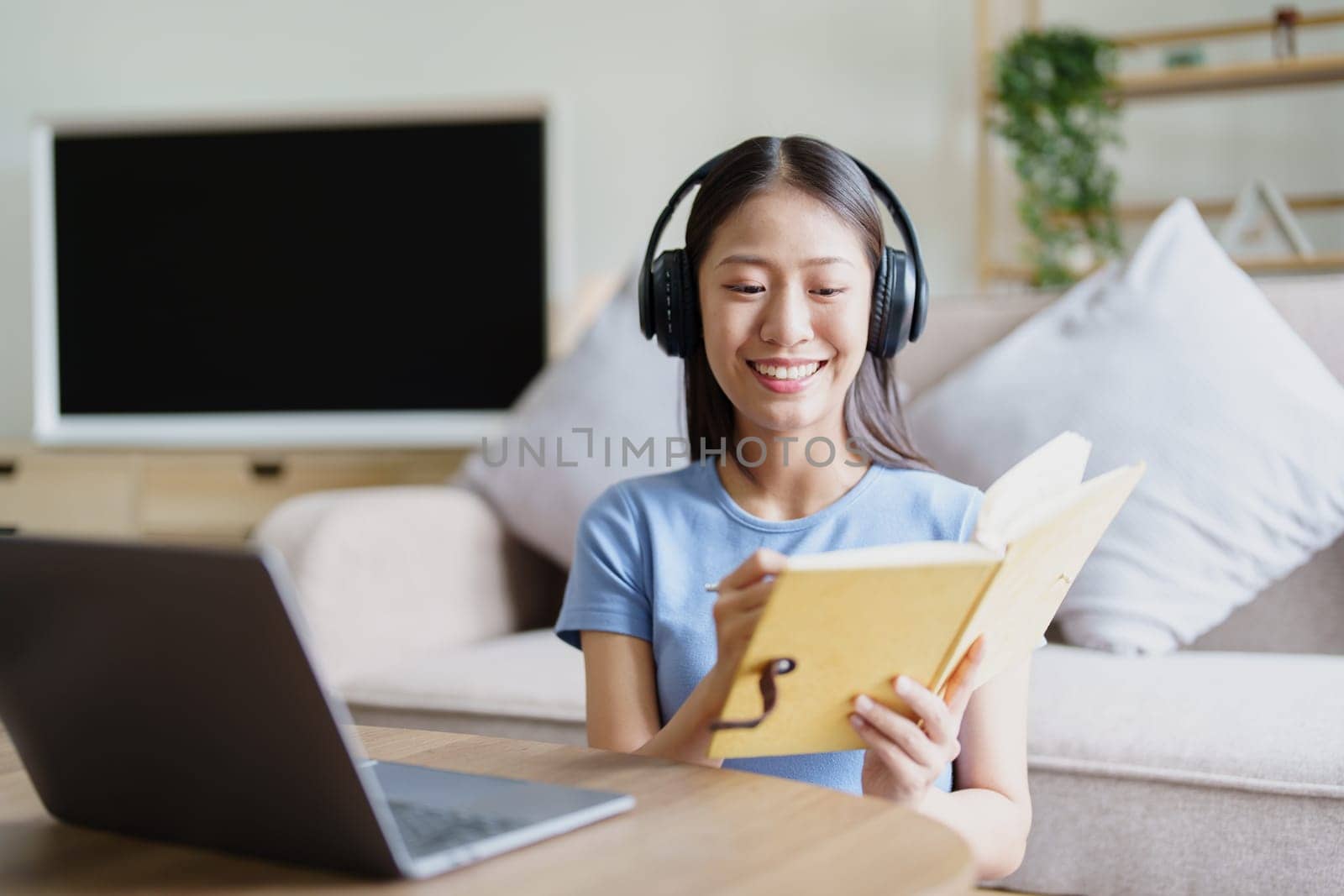 Studying online, beautiful Asian female student or student studying online at home.