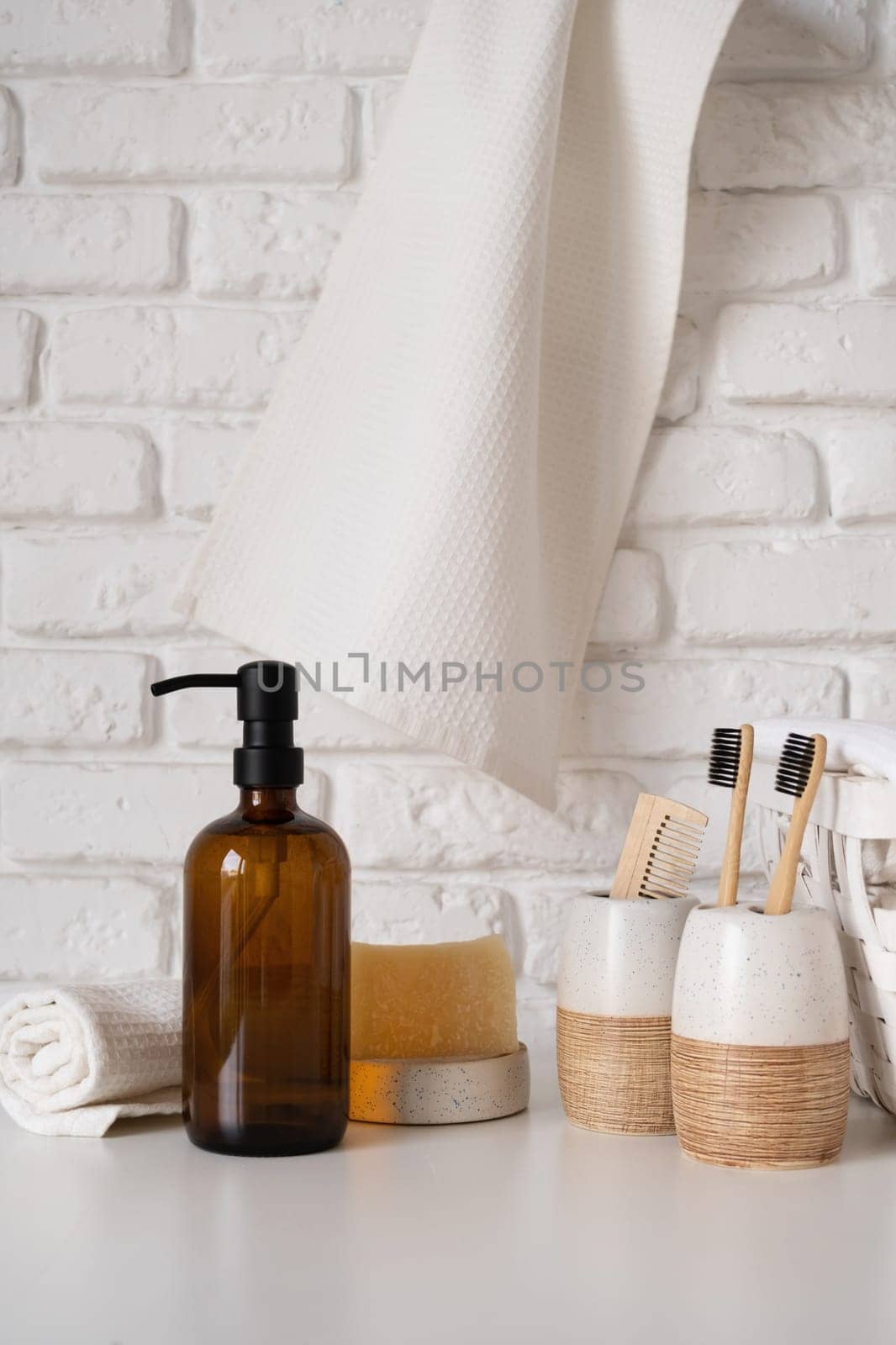 Recycled plastic pump bottle for mock-up. Minimalism brand packaging mockup design on white brick wall background