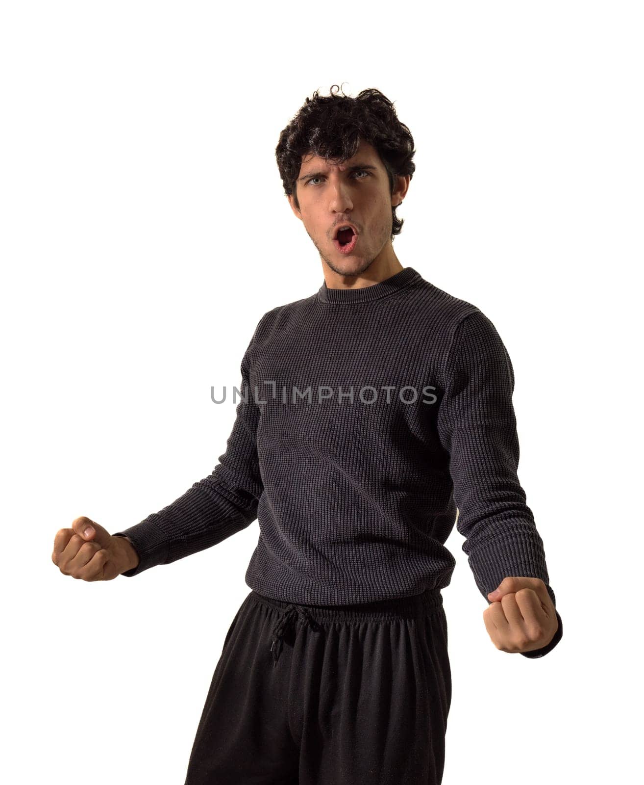 A man with his mouth open and his hands out in a victorious pose, celebrating something positive