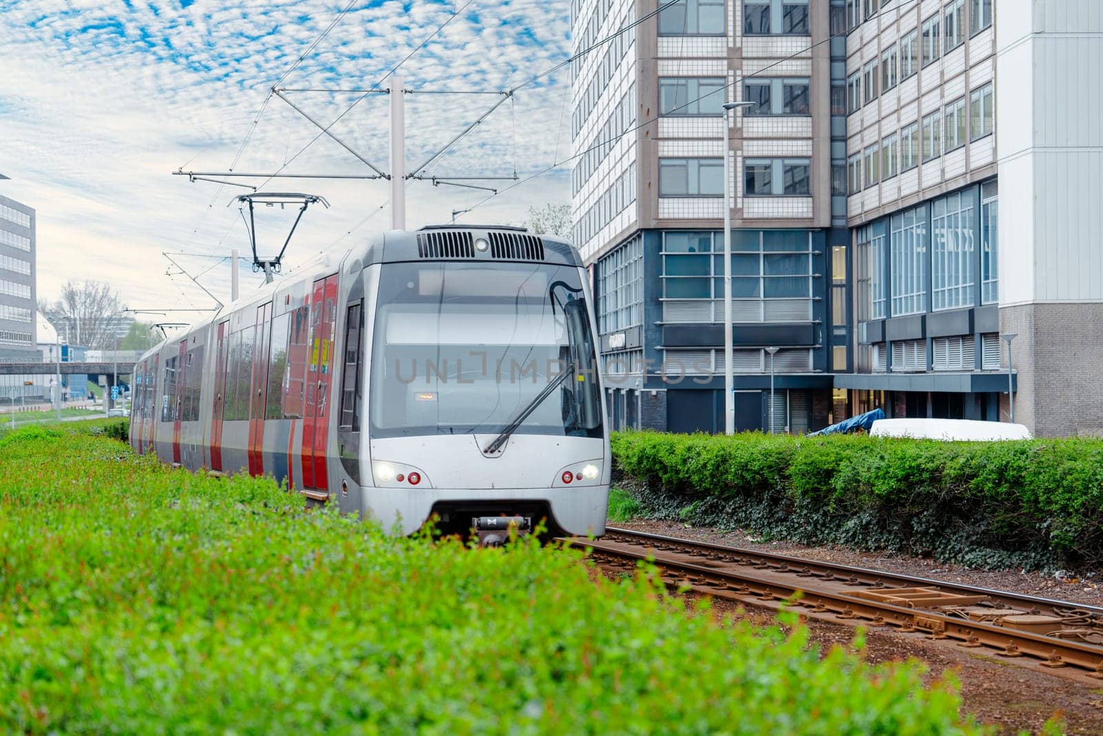 Uncover Rotterdam's electrified urban transport system featuring a network of public trams, providing reliable and environmentally conscious travel options in the city.