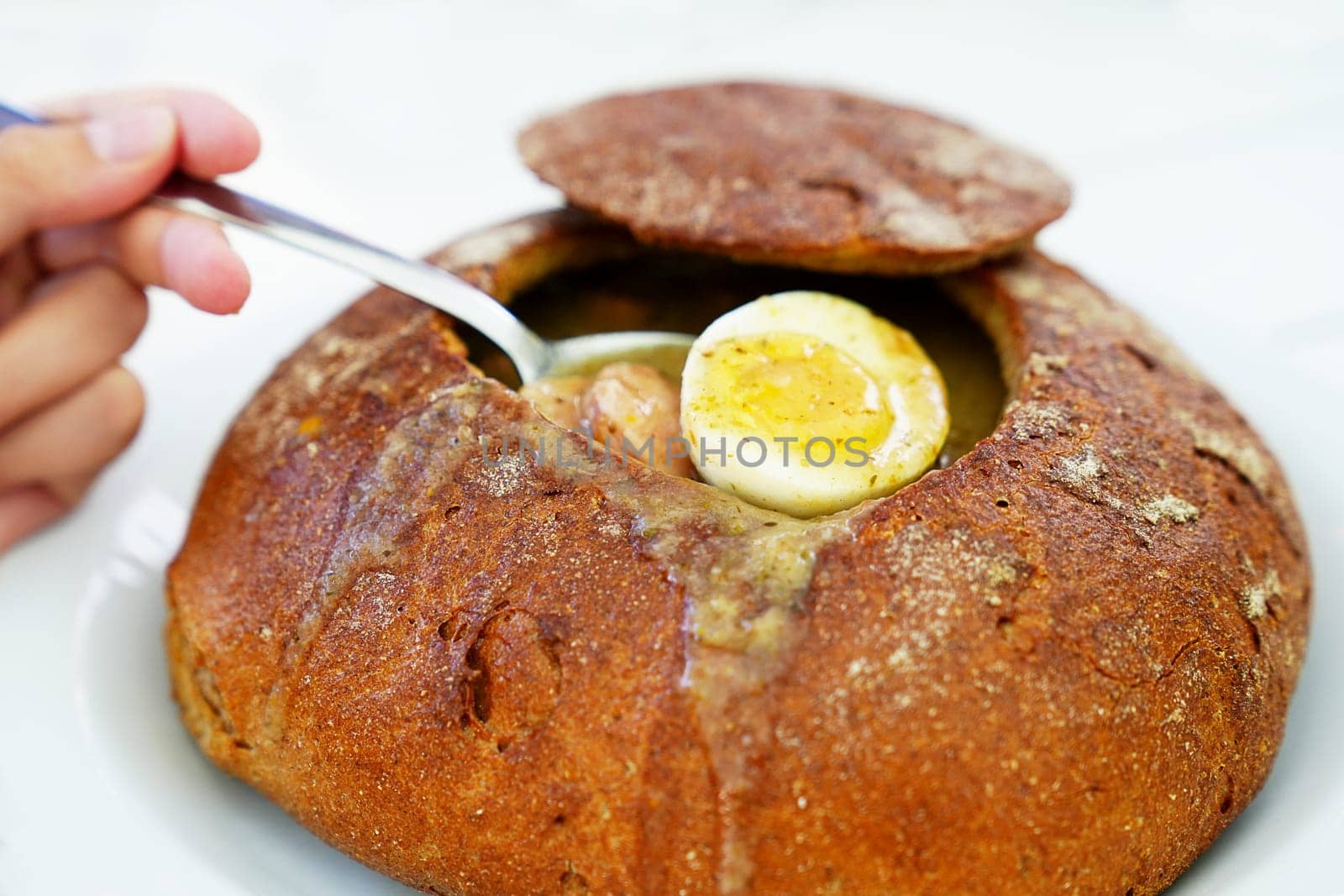 Authentic Polish Cuisine: Savor the Flavor of Soup in a Freshly Baked Bread Loaf, the National Dish by PhotoTime