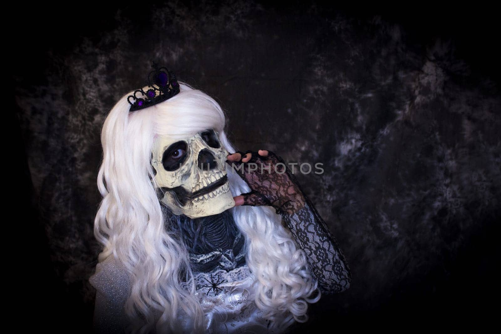 Woman dressed as dead halloween. One person.