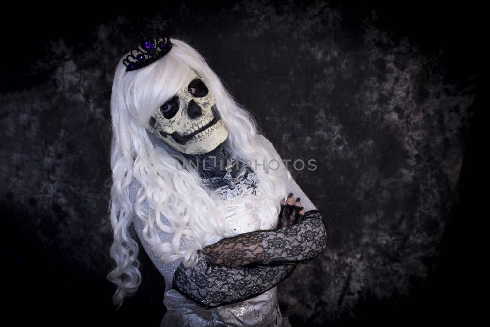 Woman dressed as dead halloween. One person.