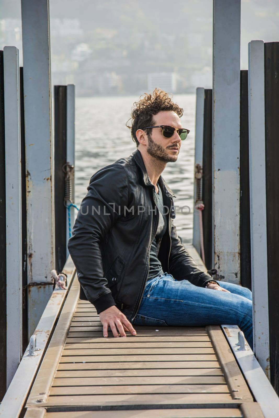 A Man Embracing Nature on a Serene Wooden Dock by artofphoto