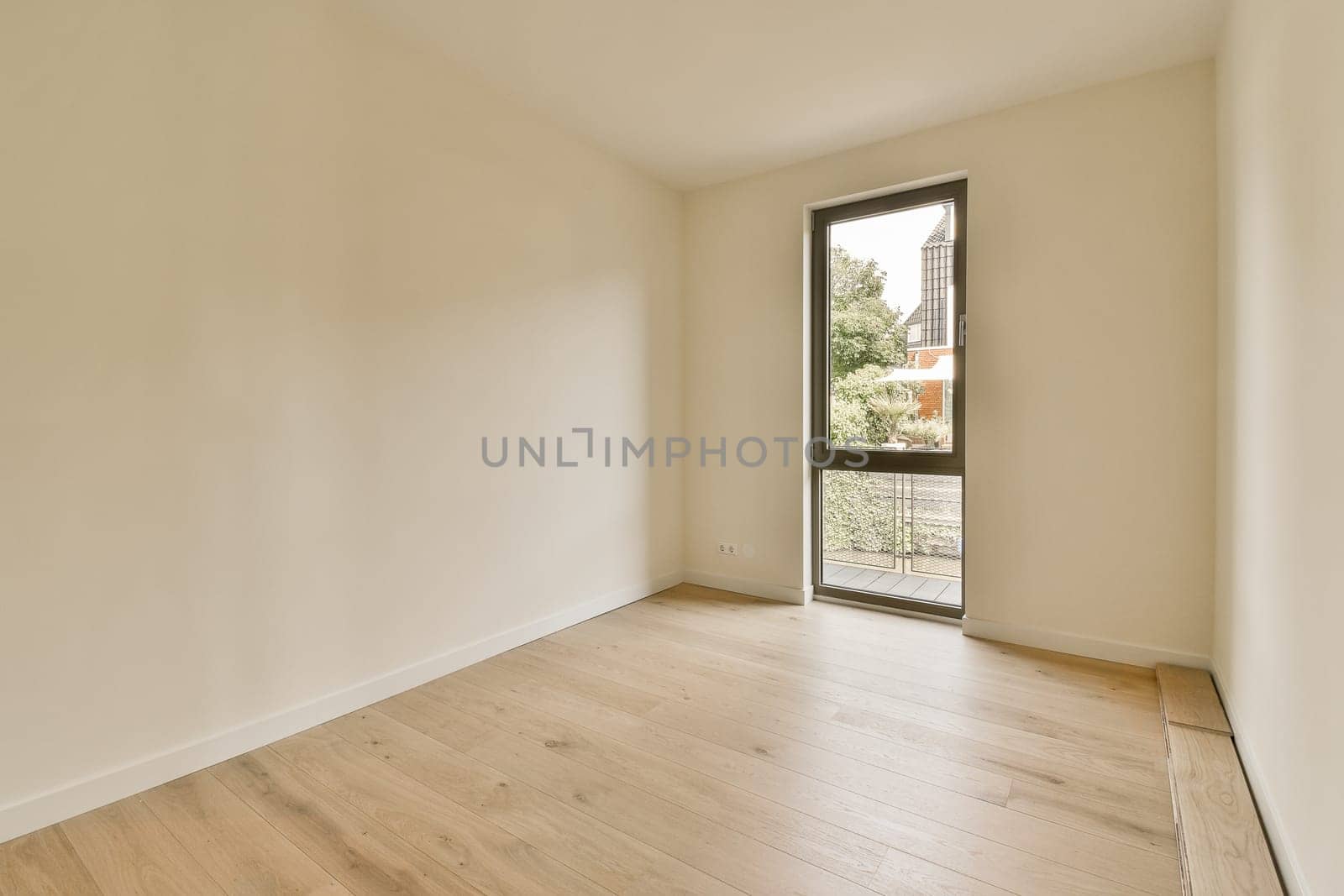 an empty room with wood flooring and large windows looking out onto the cityscapearrons com