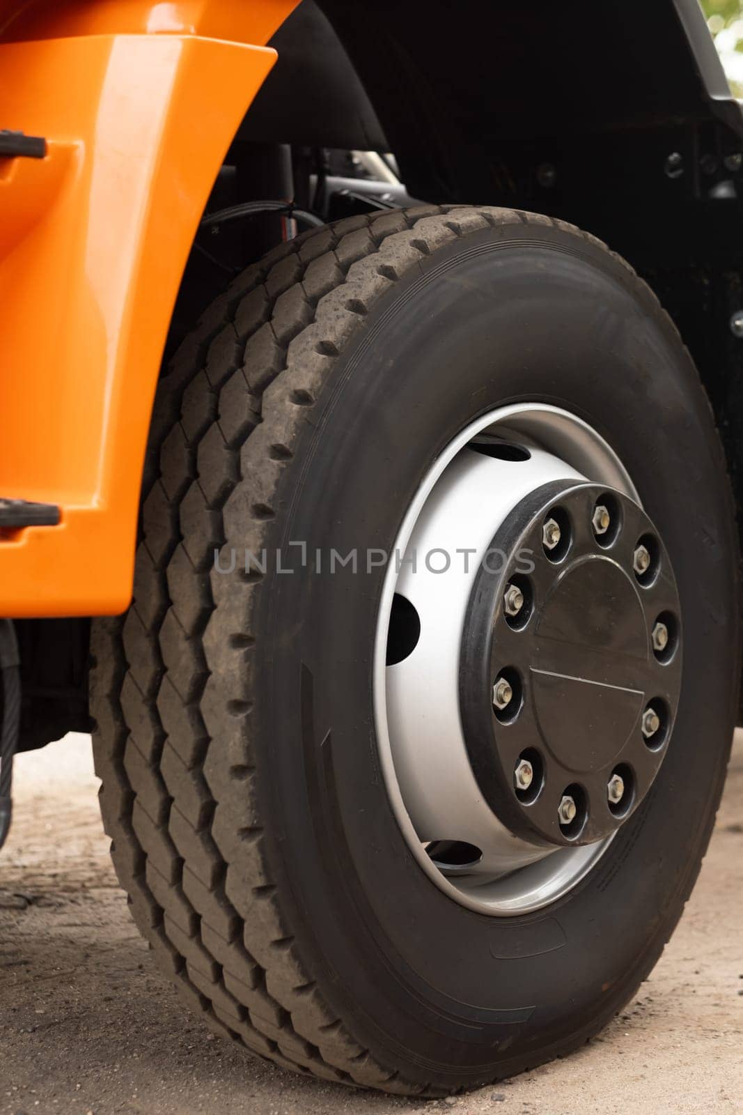 a large wheel with a truck tire. Tire fitting concept.