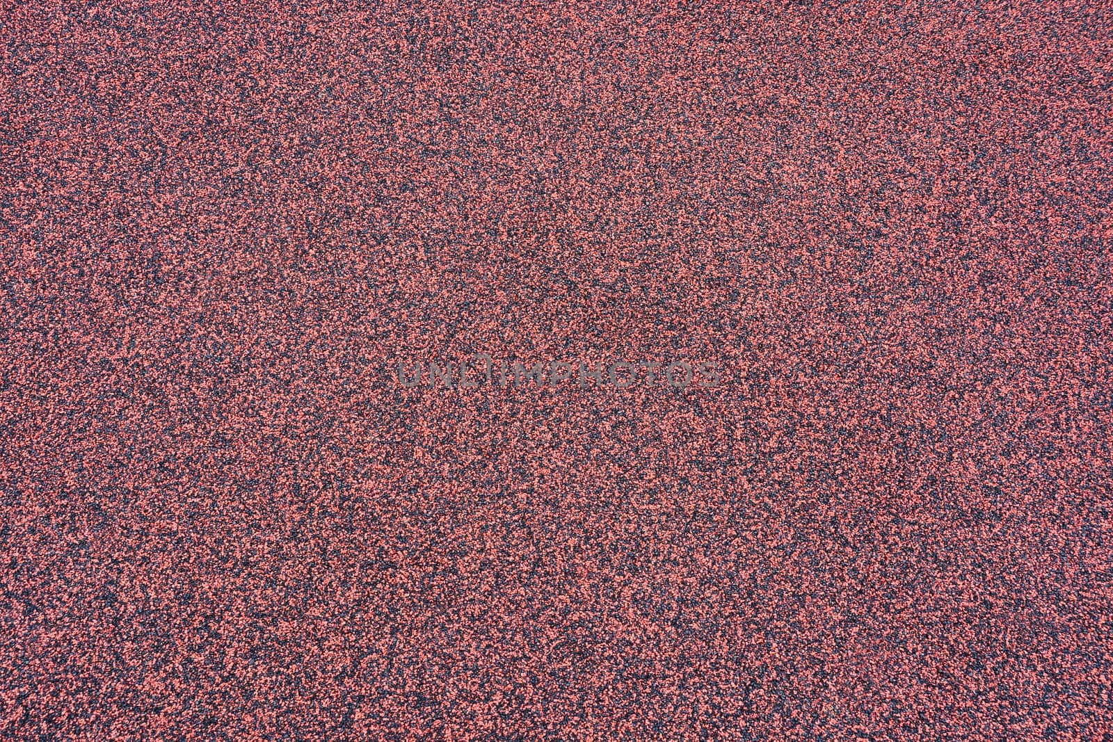Running track rubber surface texture from a sport's stadium. Floor eco surface manufactured from recycled tires