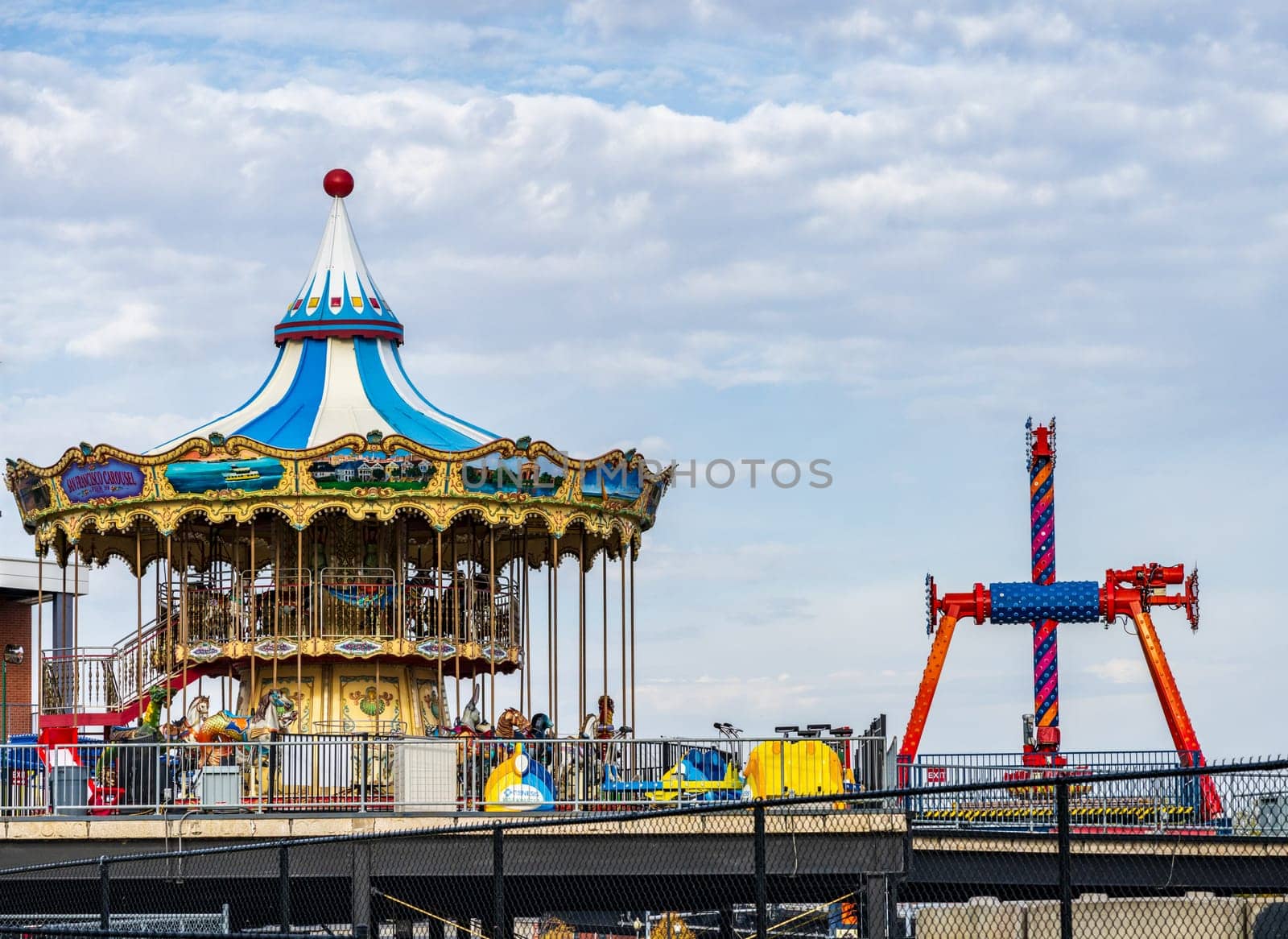 Davenport, IA - 18 October 2023: Dismantling fairground rides in amusement park for winter