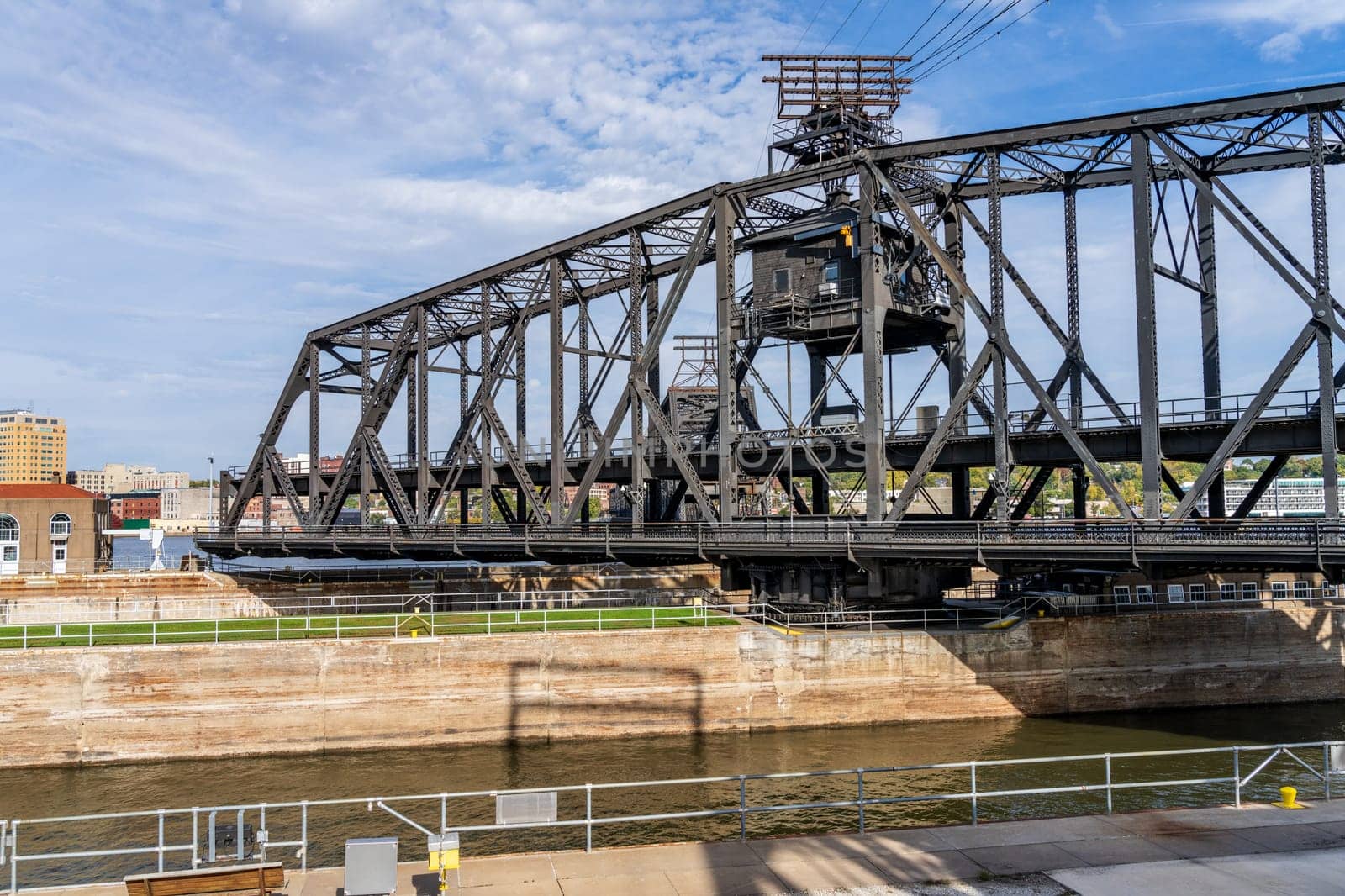 Historic swing span of the Arsenal or Government bridge swings open over the Lock and Dam No. 15 in Davenport, Iowa