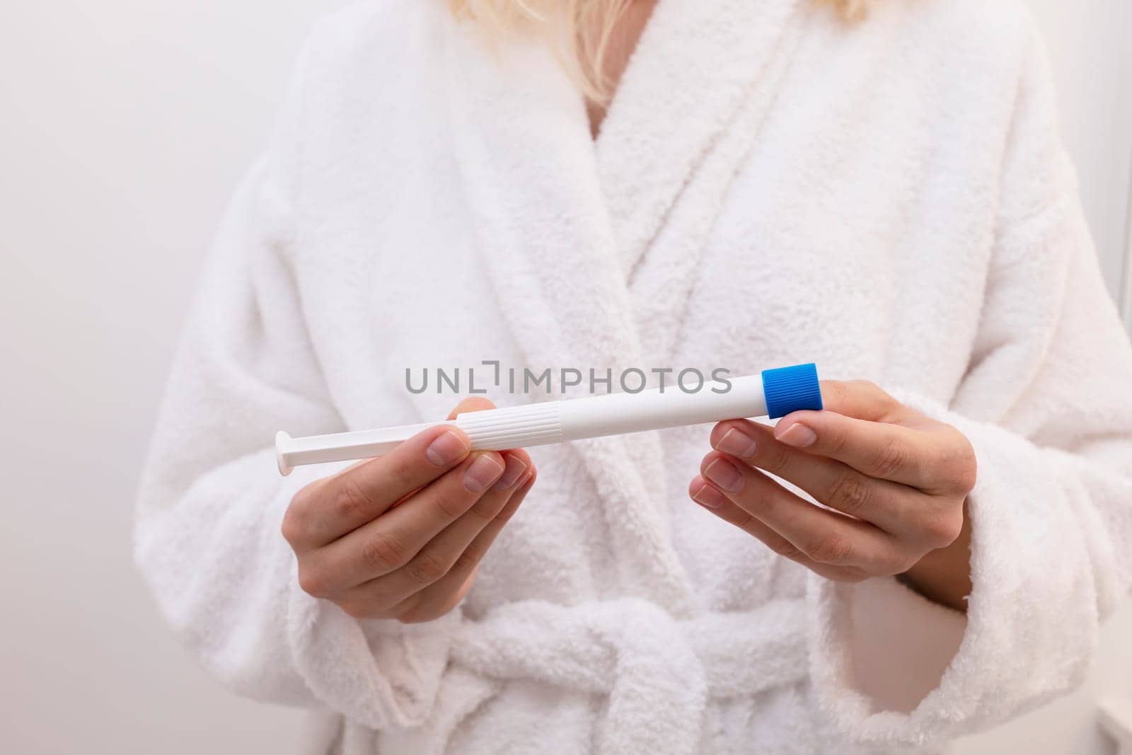 Woman Holds Pre-filled Applicator With Vaginal Antifungal Treatment Cream Or Gel. Caucasian Female Is Ready To Insert Tioconazole Remedy, Ointment Against Infections. Horizontal. by netatsi