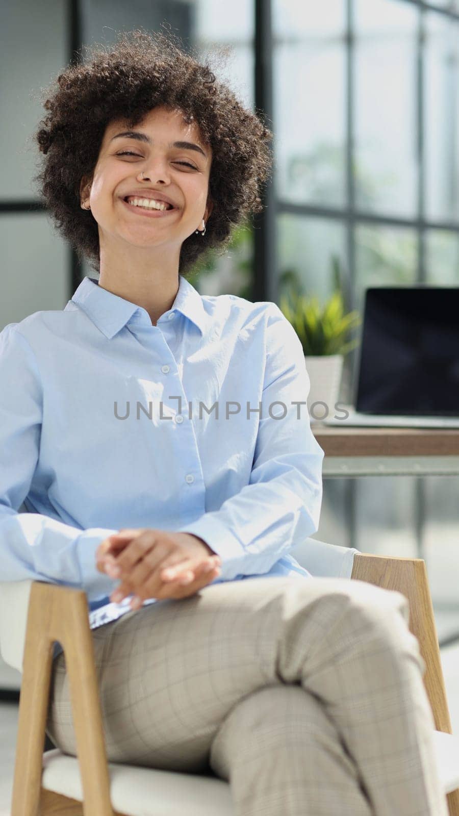 girl in the office smiles expresses success and leadership is thinking about success by Prosto