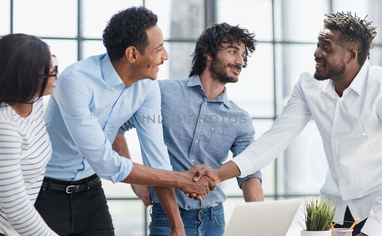 Successful Business Collaboration: Executives Greet with Handshake in Office by Prosto