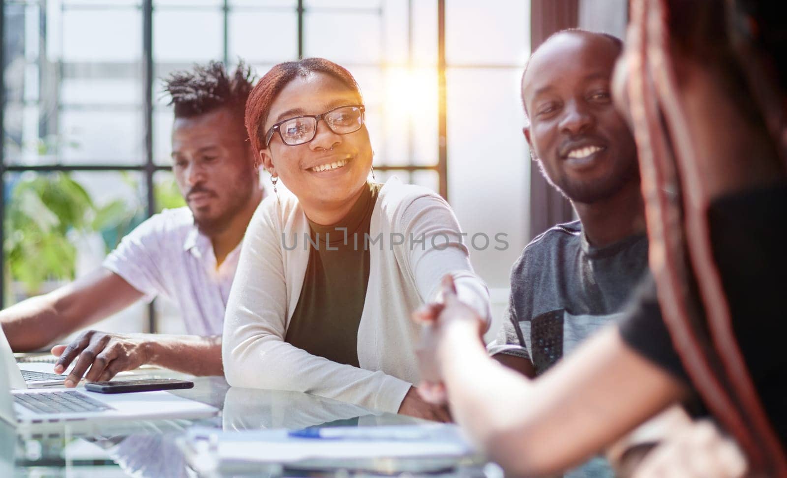 african business people handshaking at modern office