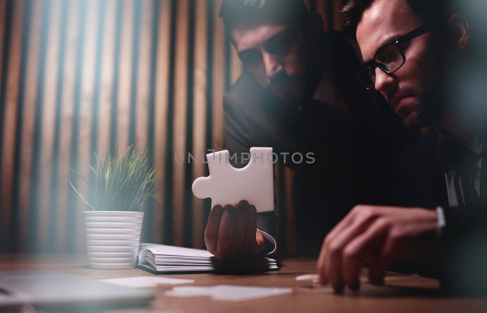 Business teamwork with white puzzle pieces cooperation unity concept by Prosto