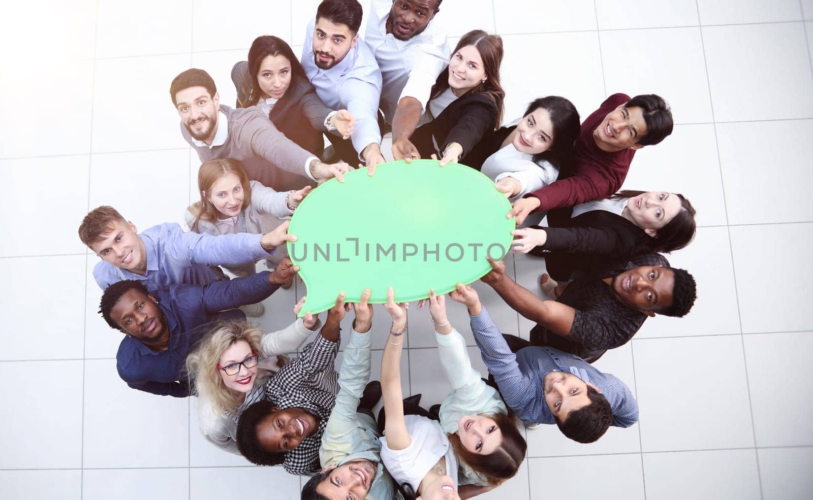 businessmen holding blank speech bubble above their heads. View from above