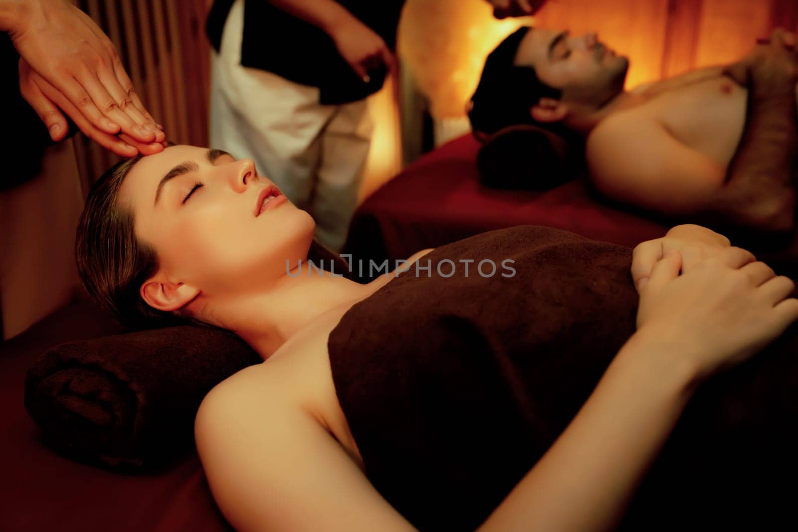 Couple customer enjoying relaxing anti-stress head massage. Quiescent by biancoblue