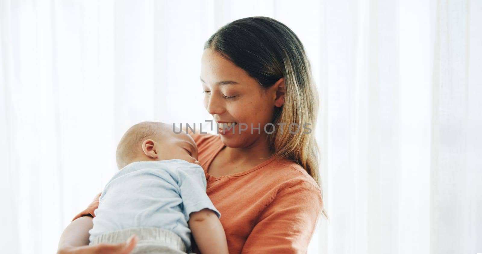 Family, love and mother with baby in home for bonding, healthy relationship and childcare in bedroom. Happy, childhood and mom and newborn infant embrace, care and affection together for happiness by YuriArcurs