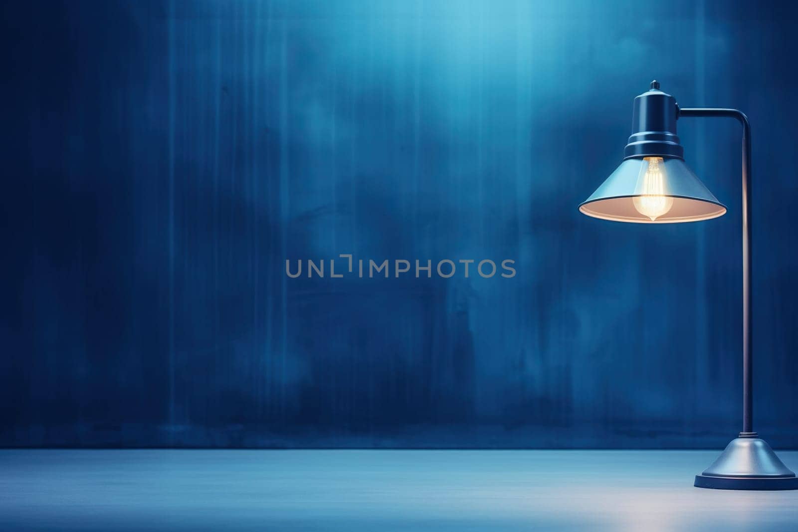 Table lamp on a blue table against the background of a blue wall.