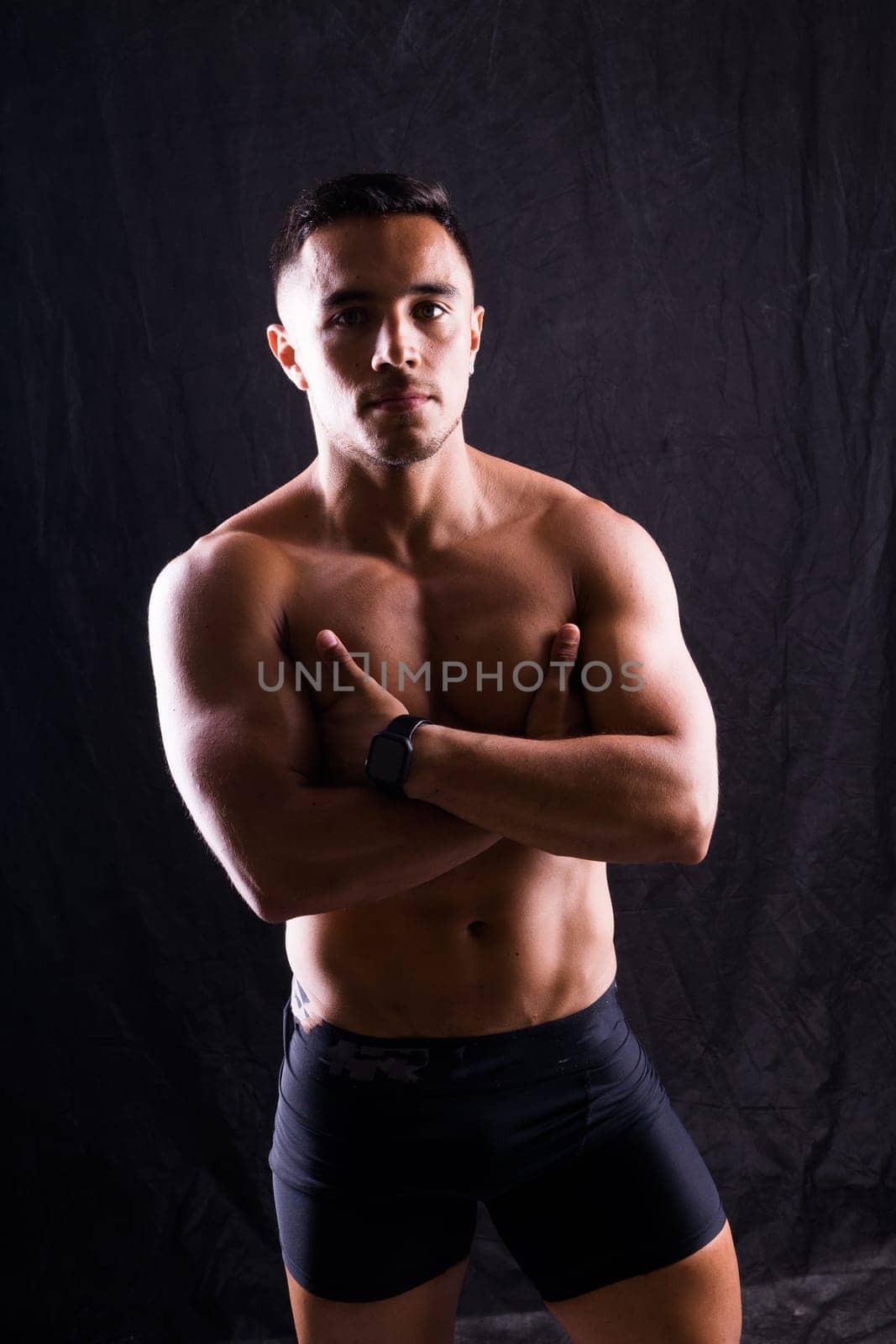 Beautiful male torso, muscular bodybuilder posing. Seductive portrait of a sport man.