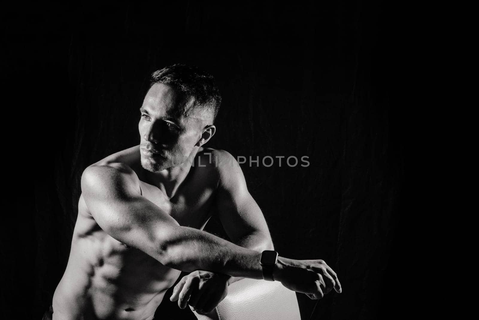 Beautiful male torso, muscular bodybuilder posing. Seductive portrait of a sport man.