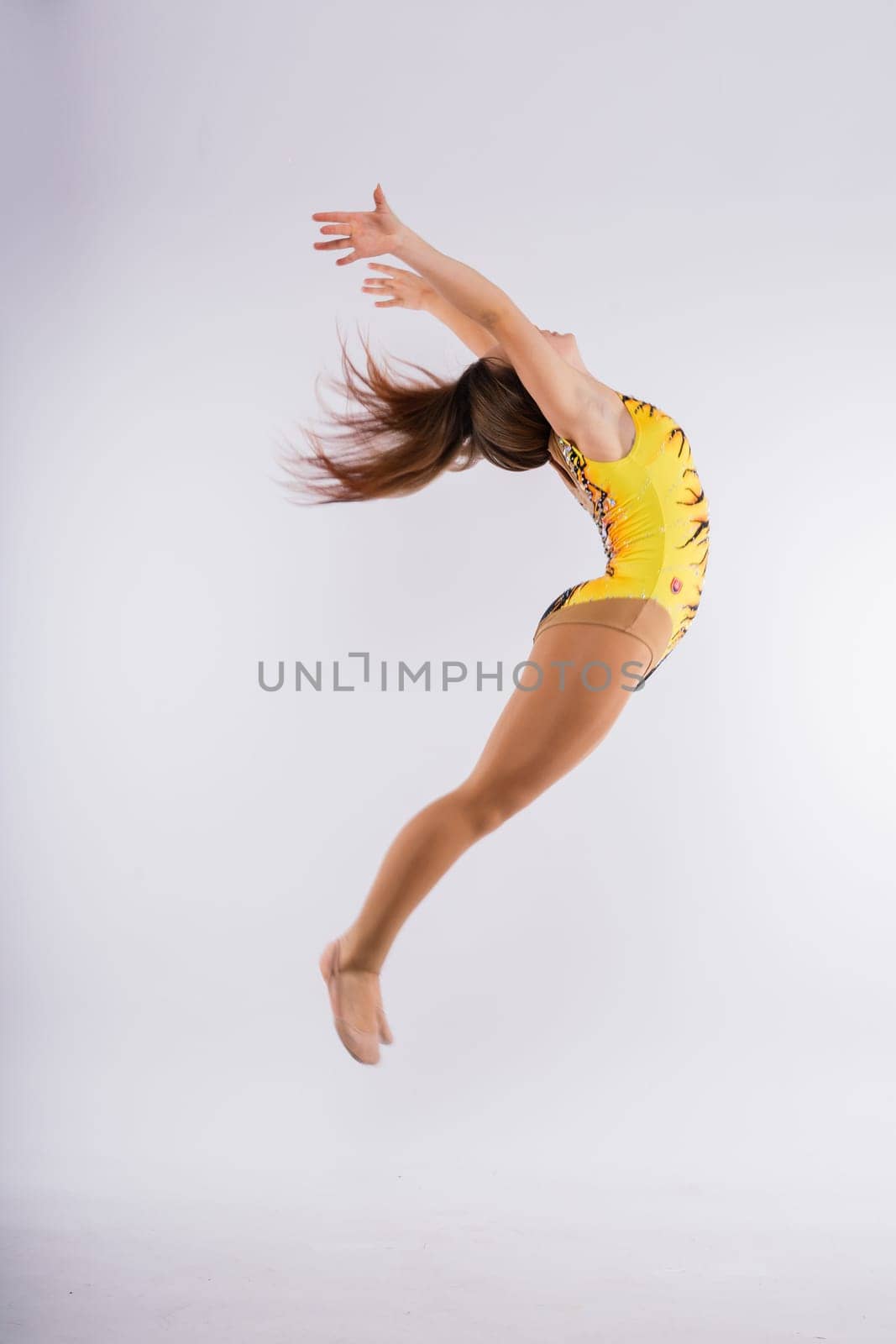 Ballet dancer in a black body paint isolated on studio background expressive artistic dance concept