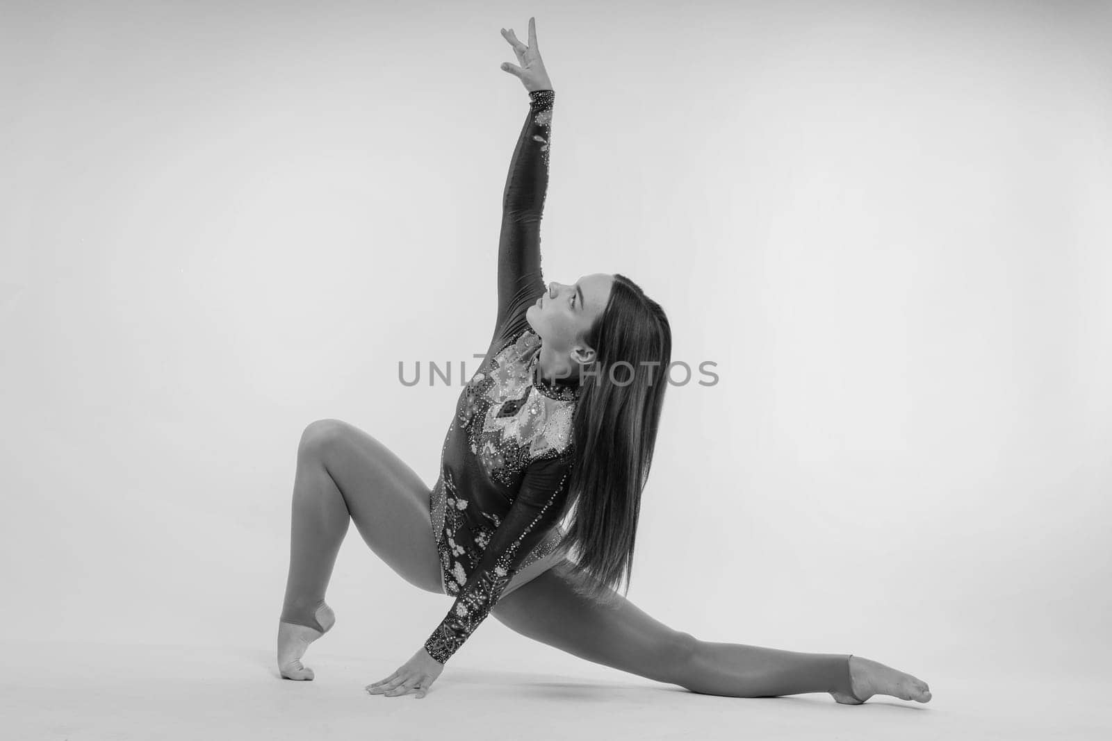 Ballet dancer in a black body paint isolated on studio background expressive artistic dance concept
