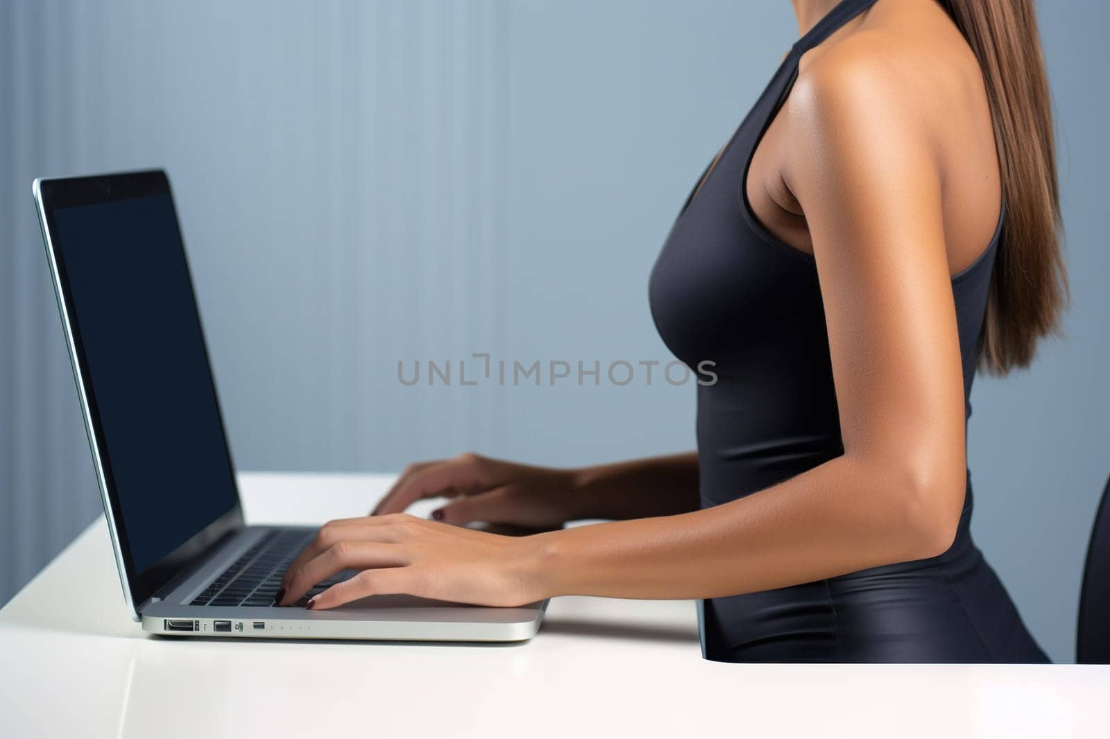 Business woman in black typing on a laptop in the workplace Woman working in the office on a keyboard.