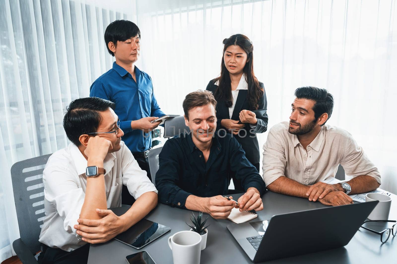 Group of diverse office worker employee working together on strategic business marketing planning in corporate office room. Positive teamwork in business workplace concept. Prudent