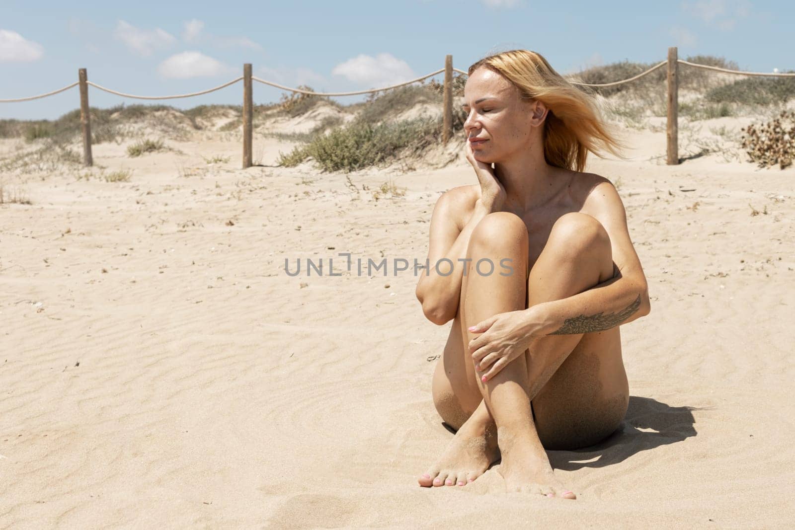 girl takes a photo on the beach , there is a place for an inscription. High quality photo