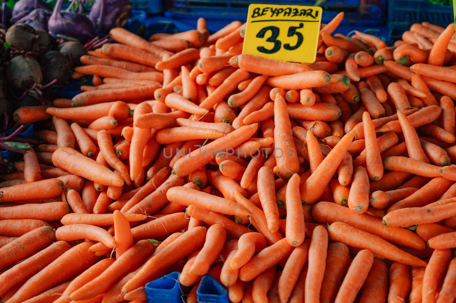 Carrot sale in the traditional farm Turkish market, a counter filled with fresh fruits